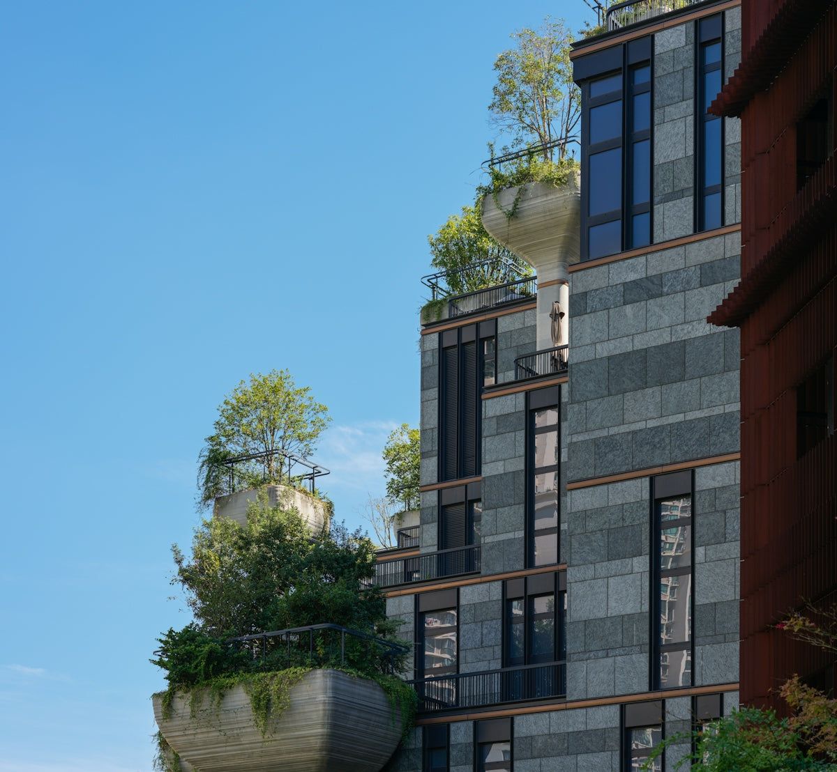 A tall building with a lot of windows on the side of it